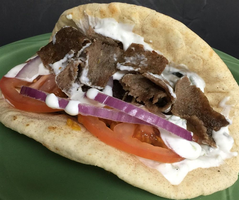 The Gyro: beef and lamb with tzatziki, tomato, and red onion in a pita