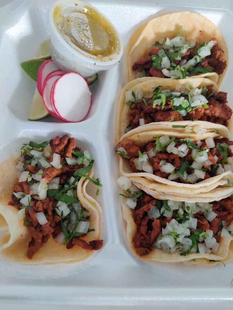Street tacos to go: carne, onions, and cilantro with salsa verde