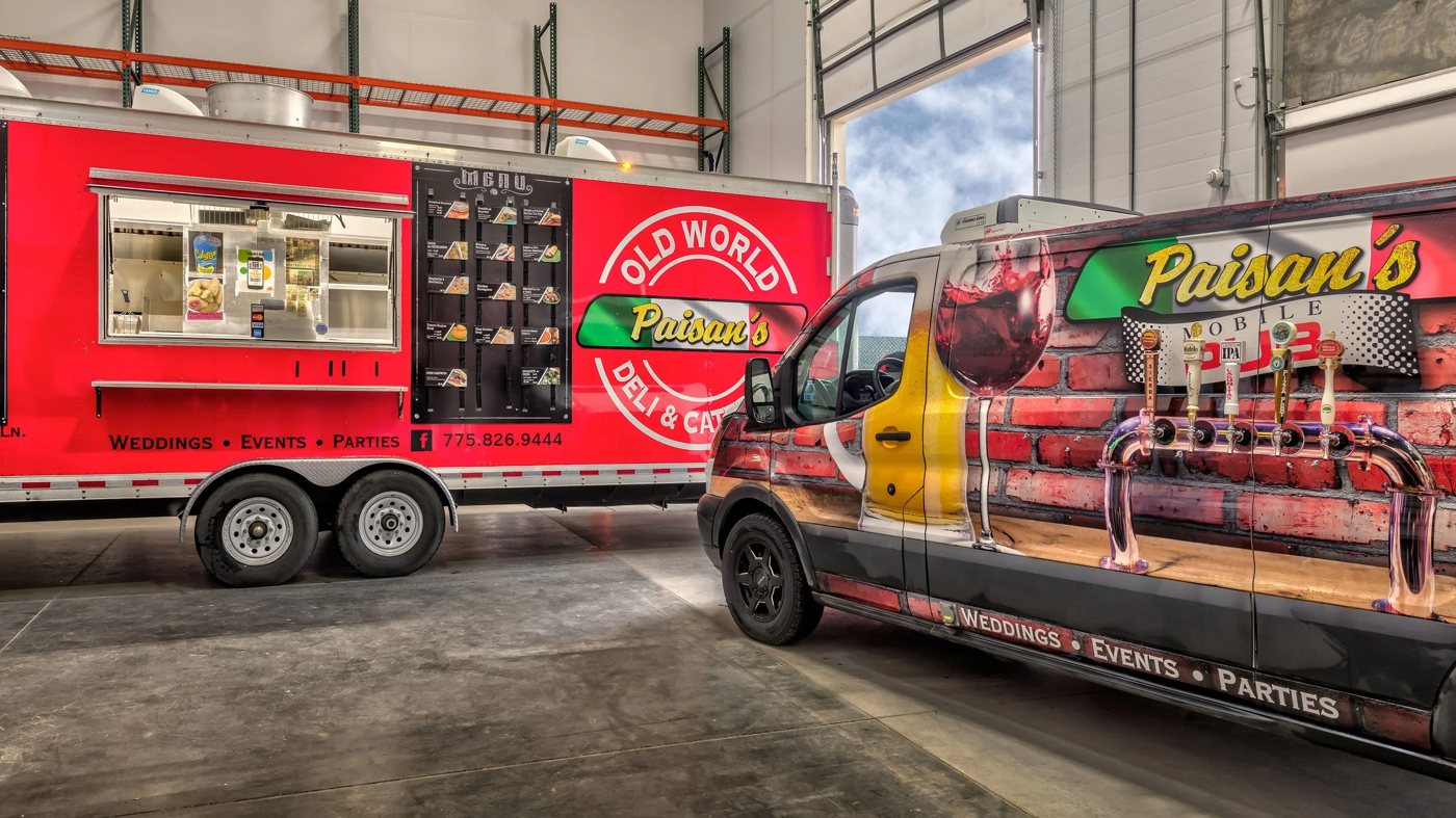 The Paisan's mobile kitchen and the Mobile Pub van, taps painted down the side